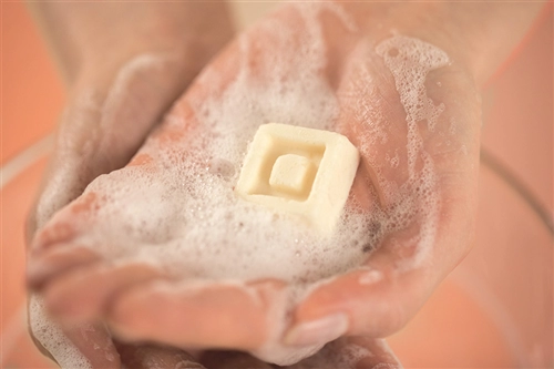 Solid shampoo formulation with pampering and protective after-feel.